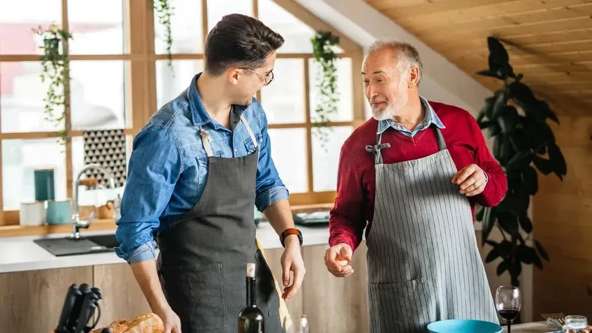 Two mens with aprons talking