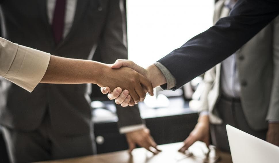 business-people-shaking-hands-in-agreement